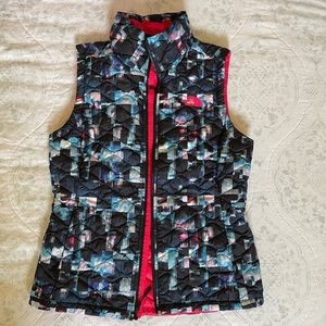 Multi-color The North Face puffer vest.